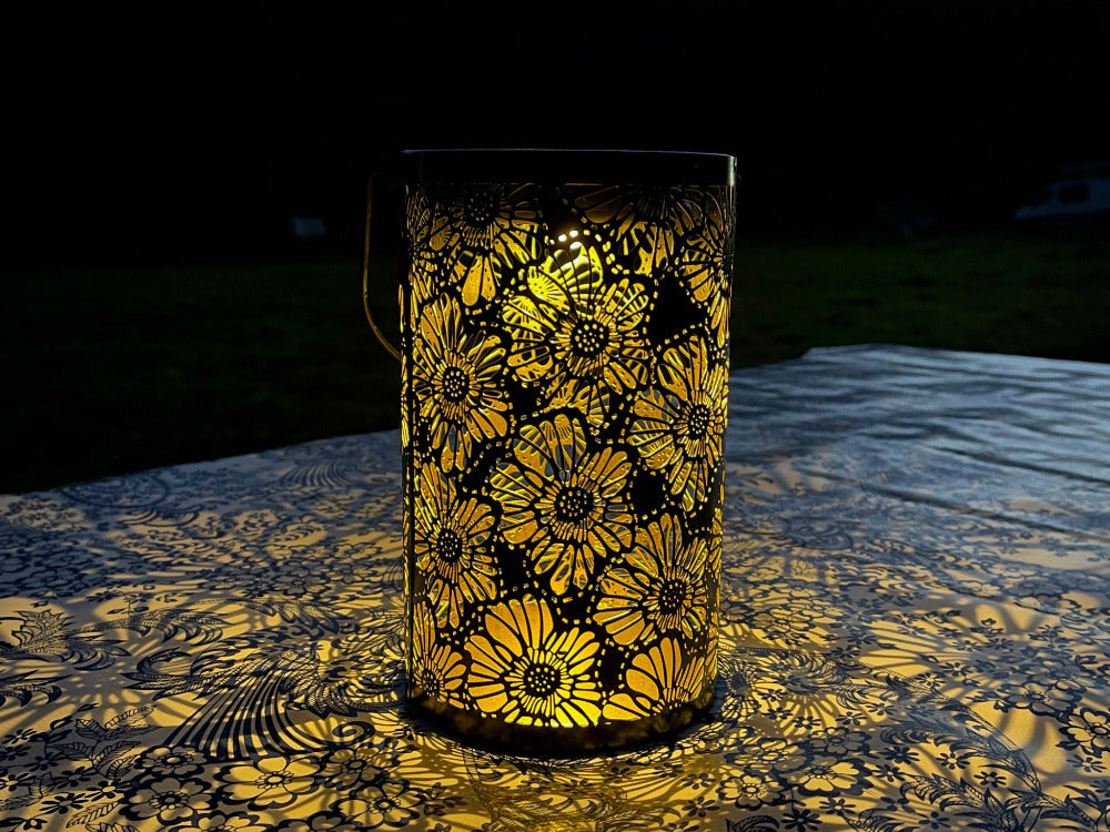 Hanging Solar Lantern Large 10" tall, on a table at night, lit up casting beautiful shadows on a table- LITO