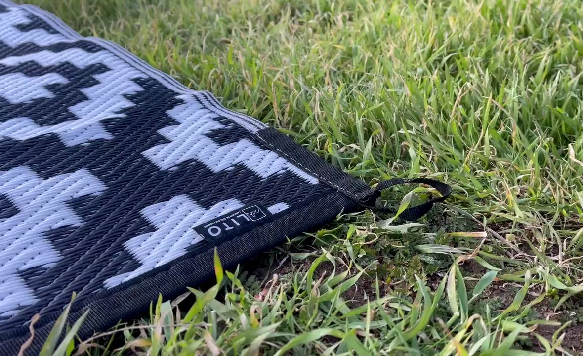A video showing how to secure a LITO outdoor camping rug into the ground