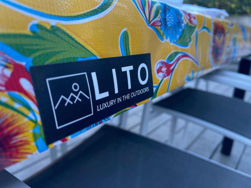 LITO logo and tagline on a flowered outdoor tablecloth