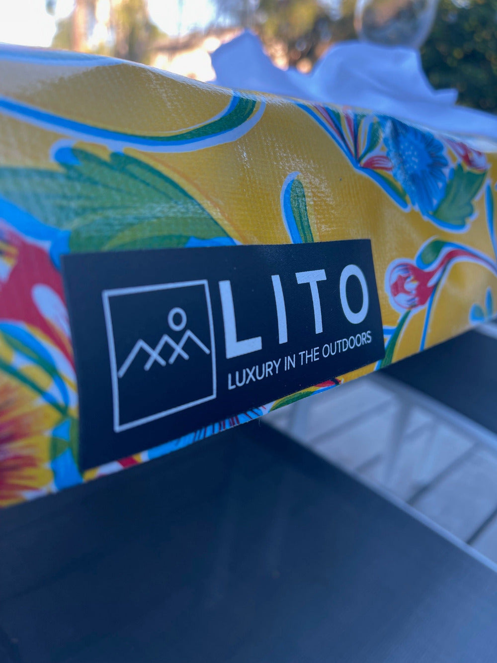 LITO logo and tagline on yellow flower outdoor tablecloth